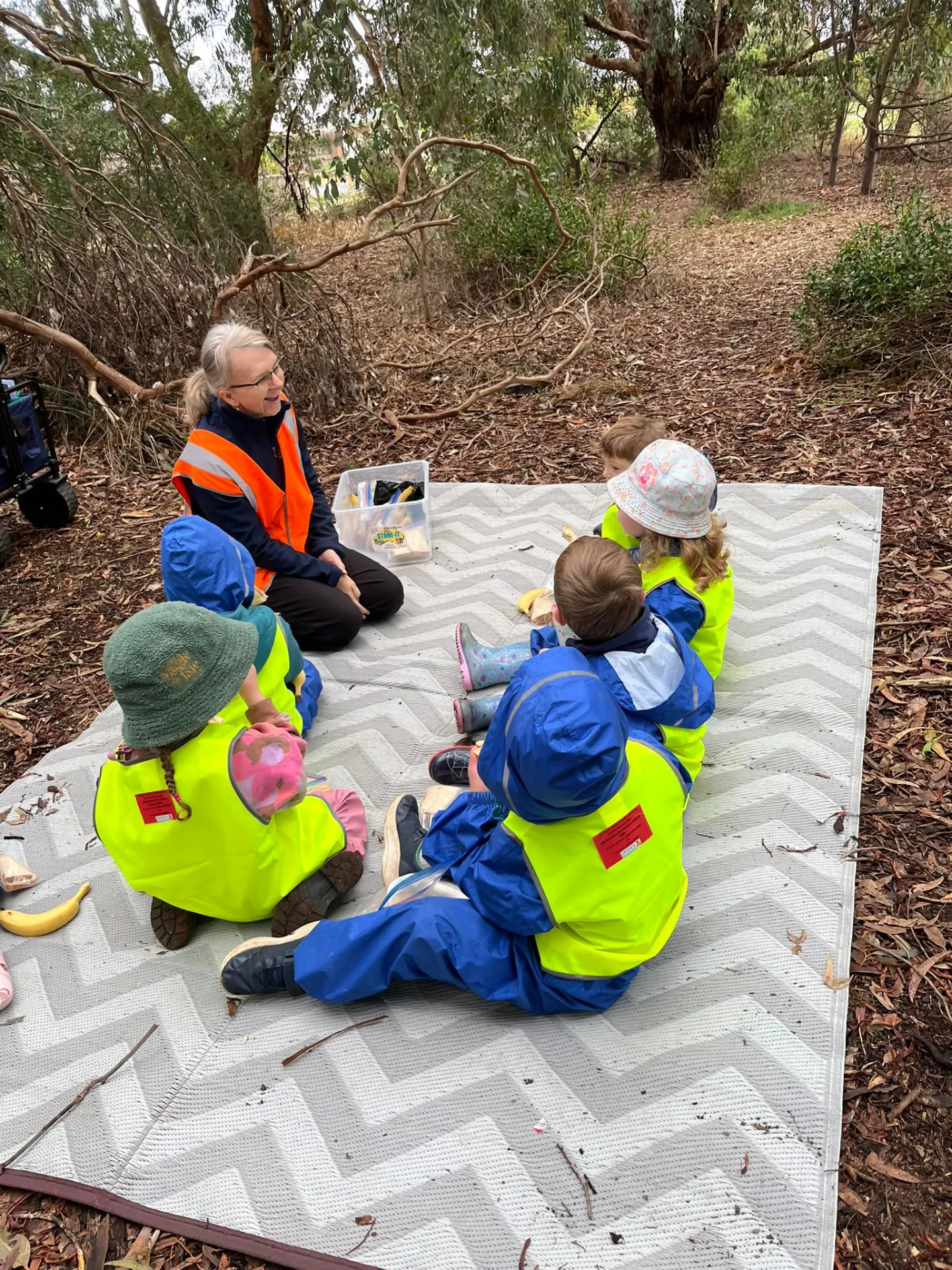 Educator and child outdoors